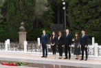 President Ilham Aliyev and family members visit the grave of national leader Heydar Aliyev at the Alley of Honour